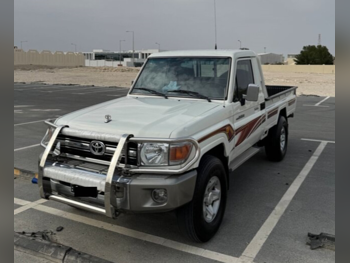 Toyota  Land Cruiser  LX  2009  Manual  248,000 Km  6 Cylinder  Rear Wheel Drive (RWD)  Pick Up  White