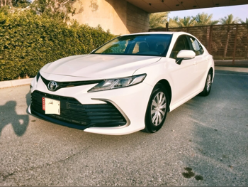 Toyota  Camry  LE  2023  Automatic  57,000 Km  4 Cylinder  Front Wheel Drive (FWD)  Sedan  White  With Warranty