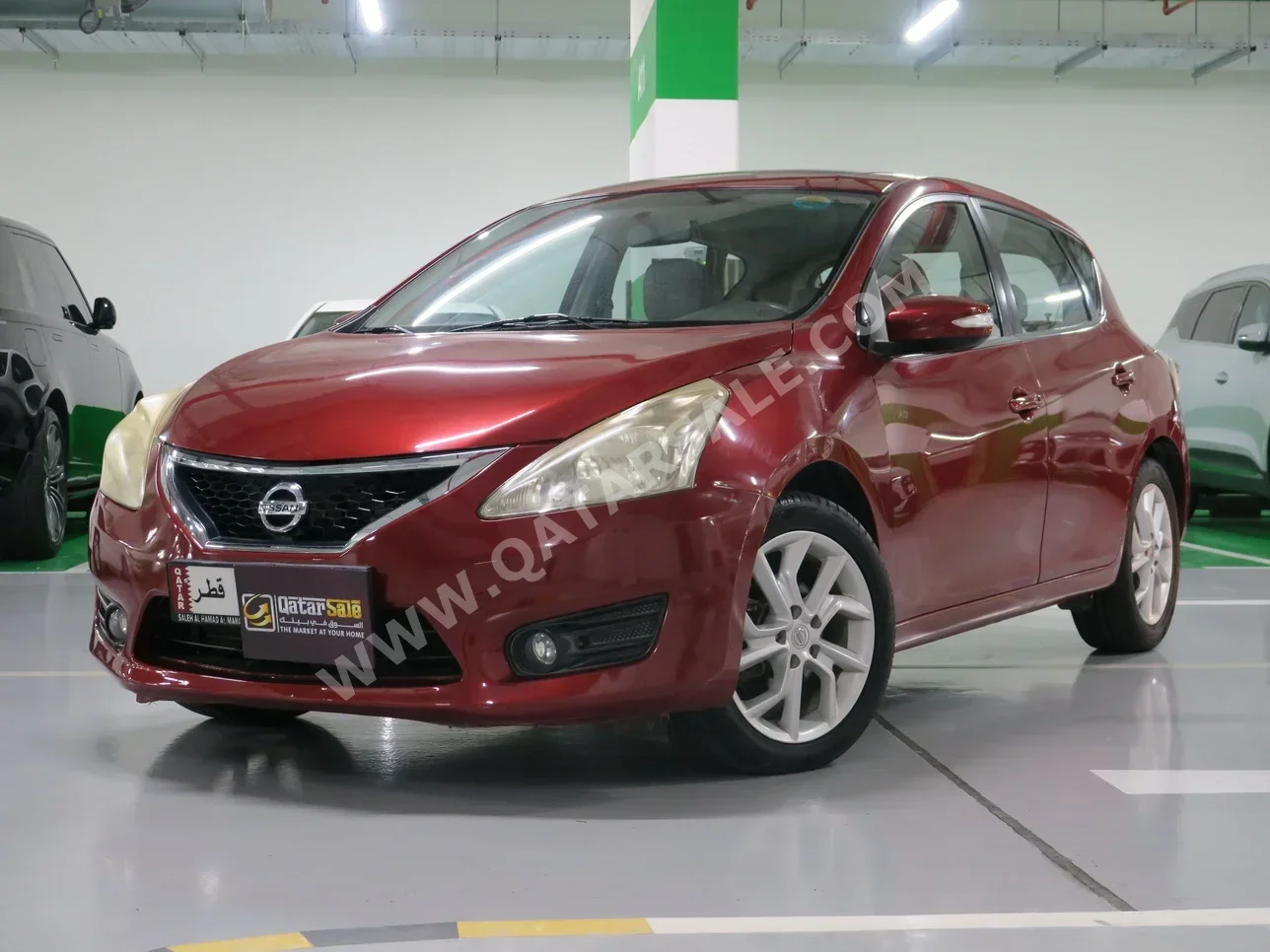 Nissan  Tiida  2014  Automatic  60,000 Km  4 Cylinder  Front Wheel Drive (FWD)  Sedan  Red