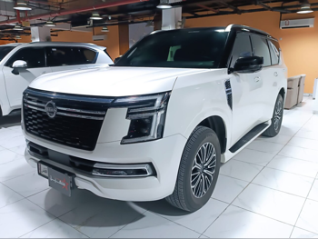 Nissan  Patrol  Platinum  2025  Automatic  51,000 Km  6 Cylinder  Four Wheel Drive (4WD)  SUV  White  With Warranty