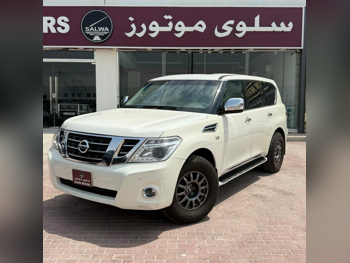 نيسان  باترول  ال اي  2013  اوتوماتيك  270,000 كم  8 سلندر  دفع رباعي  اس يو في  أبيض