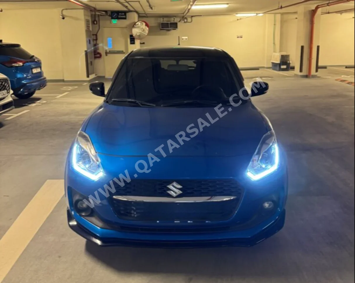 Suzuki  Swift  2024  Automatic  38,400 Km  4 Cylinder  Front Wheel Drive (FWD)  Hatchback  Black and Blue  With Warranty
