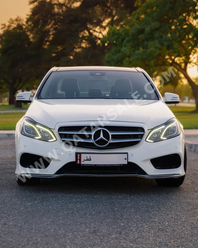 Mercedes-Benz  E-Class  300  2014  Automatic  61,500 Km  6 Cylinder  Rear Wheel Drive (RWD)  Sedan  White