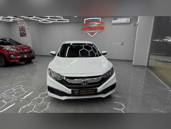 Honda  Civic  LXI  2021  Automatic  85,000 Km  4 Cylinder  Front Wheel Drive (FWD)  Sedan  White