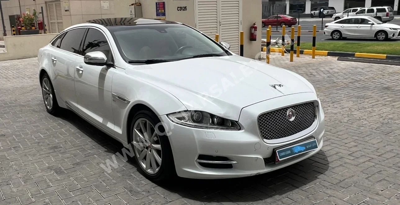 جاكوار اكس ج 6 2014 اوتوماتيك 104,000 كم 6 سلندر دفع خلفي سيدان أبيض