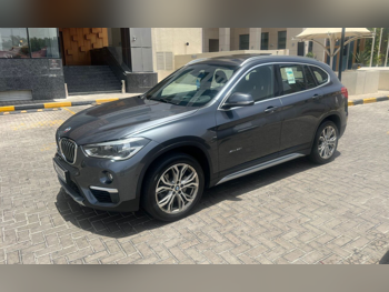 BMW  X-Series  X1  2018  Automatic  92,000 Km  4 Cylinder  All Wheel Drive (AWD)  SUV  Gray