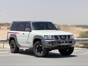 Nissan  Patrol  Super Safari  2021  Automatic  66,000 Km  6 Cylinder  Four Wheel Drive (4WD)  SUV  White