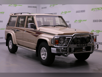 نيسان باترول سوبر سفاري 1997 عادي 289,000 كم 6 سلندر دفع رباعي اس يو في ذهبي