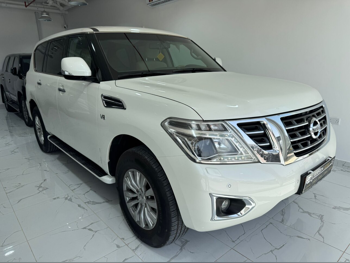 Nissan  Patrol  SE  2015  Automatic  21,000 Km  8 Cylinder  Four Wheel Drive (4WD)  SUV  White