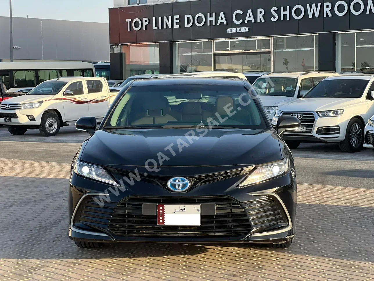 Toyota  Camry  Hybrid  2022  Automatic  213,000 Km  4 Cylinder  Front Wheel Drive (FWD)  Sedan  Black