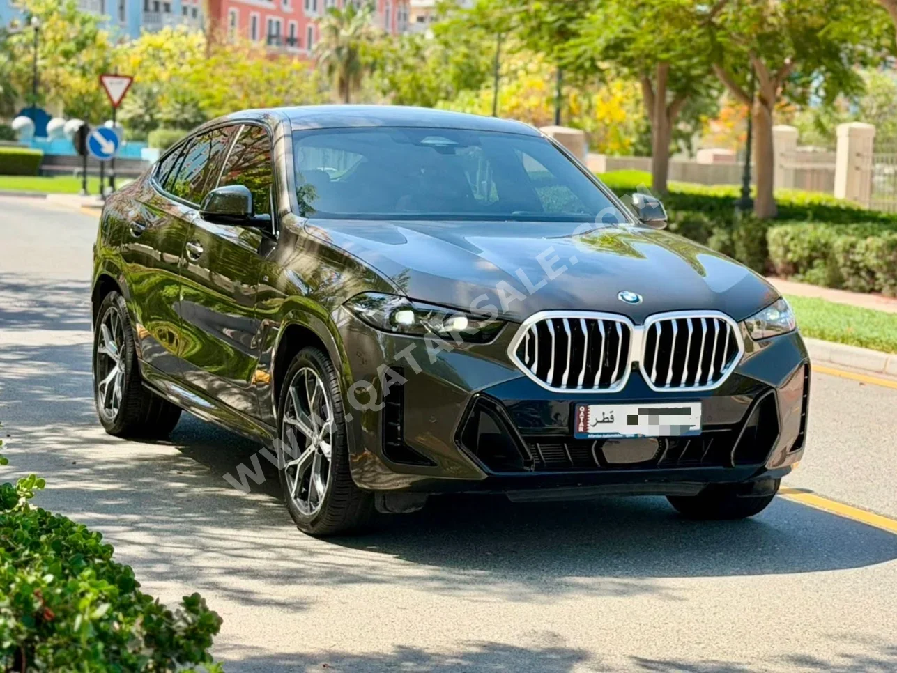 بي ام دبليو الفئة - اكس اكس 6 40i ام 2025 اوتوماتيك 13,000 كم 6 سلندر دفع رباعي اس يو في بني غامق تحت الضمان