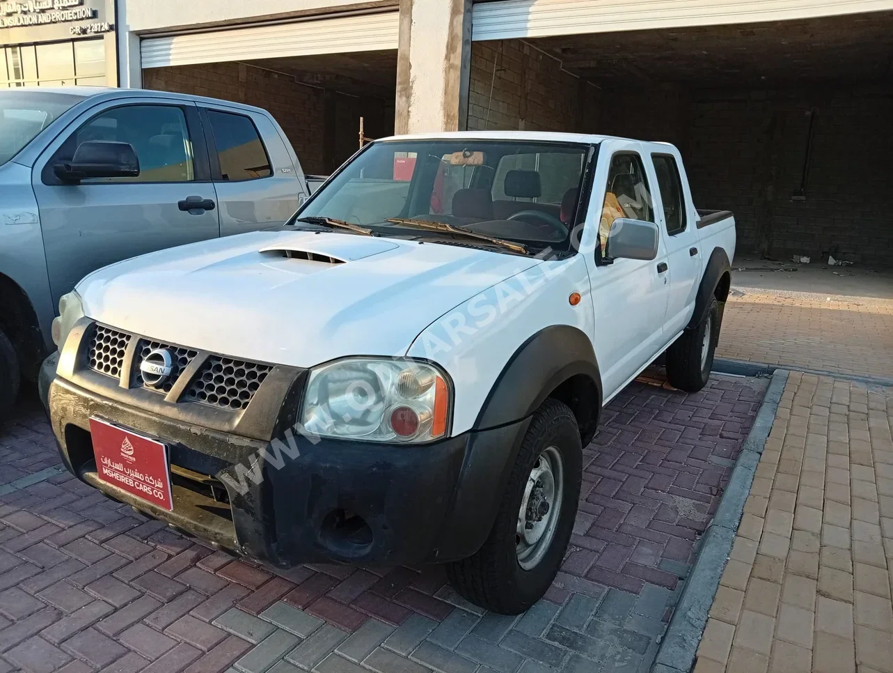 نيسان بيك أب 2008 عادي 999,000 كم 4 سلندر دفع خلفي بيكب أبيض