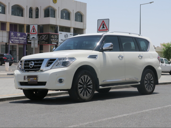 Nissan Patrol Platinum 2014 Automatic 299,000 Km 8 Cylinder Four Wheel Drive (4WD) SUV White