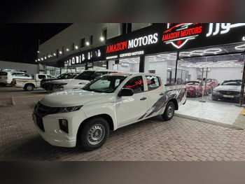 Mitsubishi  L 200  2023  Manual  85,000 Km  4 Cylinder  Rear Wheel Drive (RWD)  Pick Up  White