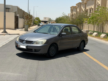 Mitsubishi  Lancer  2009  Automatic  225,000 Km  4 Cylinder  Front Wheel Drive (FWD)  Sedan  Gray