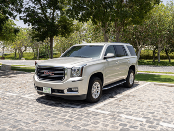 GMC  Yukon  SLE  2015  Automatic  158,000 Km  8 Cylinder  Four Wheel Drive (4WD)  SUV  Gold