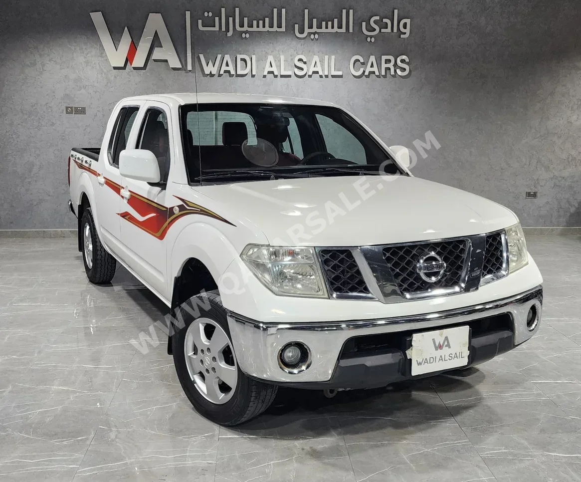 نيسان  نافارا  أس اي  2015  اوتوماتيك  234,000 كم  4 سلندر  دفع خلفي  بيكب  أبيض