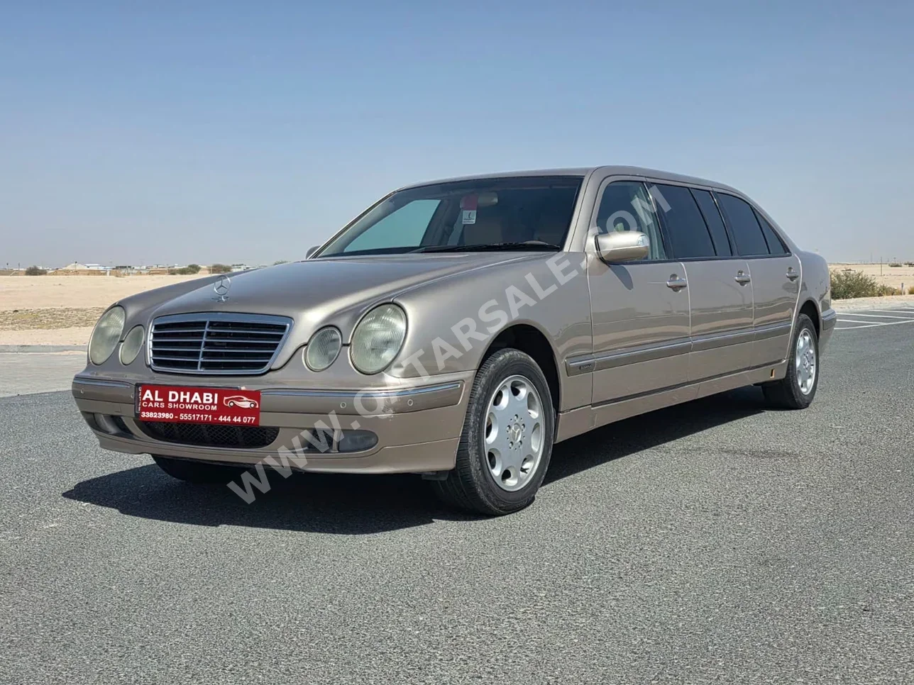 Mercedes-Benz  E-Class  200  2001  Automatic  27,000 Km  4 Cylinder  Rear Wheel Drive (RWD)  Sedan  Gold