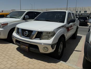 Nissan  Navara  SE  2013  Manual  130,000 Km  4 Cylinder  Rear Wheel Drive (RWD)  Pick Up  White
