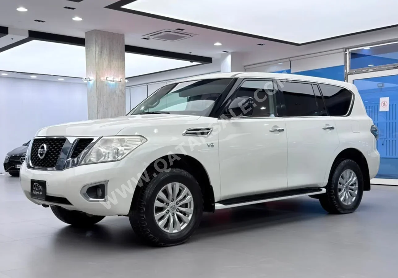 Nissan  Patrol  SE  2015  Automatic  286,000 Km  8 Cylinder  Four Wheel Drive (4WD)  SUV  White