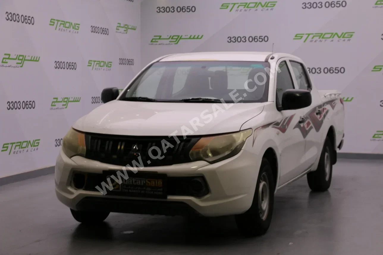 Mitsubishi  L 200  2017  Manual  189,000 Km  4 Cylinder  Rear Wheel Drive (RWD)  Pick Up  White