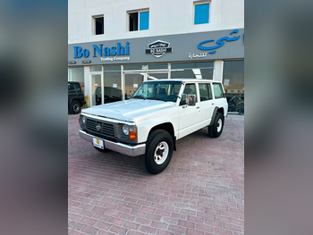 نيسان باترول جي ال 1997 عادي 118,000 كم 6 سلندر دفع رباعي اس يو في أبيض