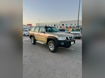 نيسان باترول جي ال 2006 عادي 172,000 كم 6 سلندر دفع رباعي اس يو في ذهبي