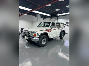 نيسان باترول جي ال 1997 عادي 555,000 كم 6 سلندر دفع رباعي اس يو في أبيض
