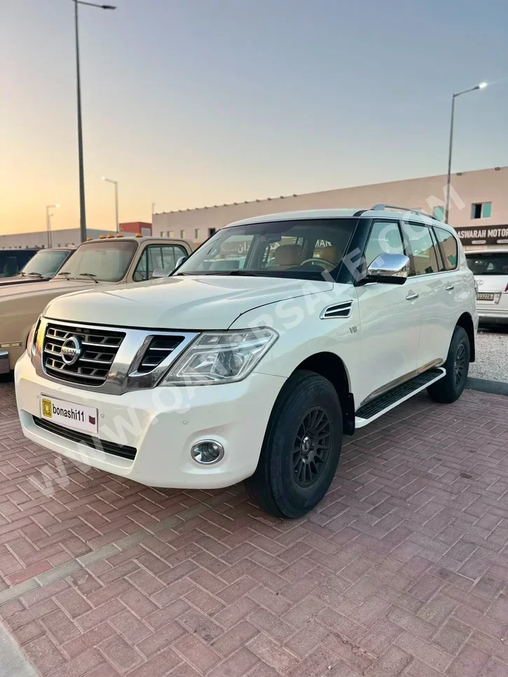 نيسان باترول اس اي بلاتينيوم 2010 اوتوماتيك 265,000 كم 8 سلندر دفع رباعي اس يو في أبيض
