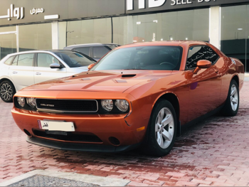 Dodge  Challenger  2011  Automatic  74,000 Km  6 Cylinder  Rear Wheel Drive (RWD)  Coupe / Sport  Orange