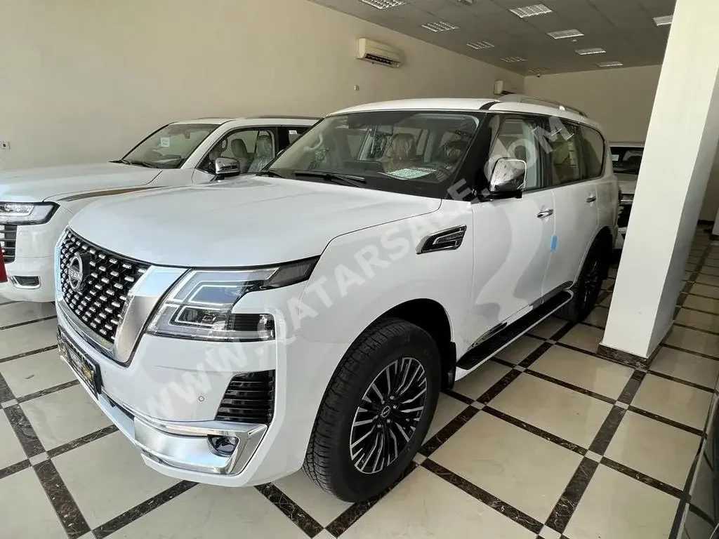 Nissan  Patrol  Platinum  2022  Automatic  0 Km  6 Cylinder  Four Wheel Drive (4WD)  SUV  White  With Warranty