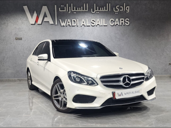 Mercedes-Benz  E-Class  300  2014  Automatic  211,000 Km  6 Cylinder  Rear Wheel Drive (RWD)  Sedan  White