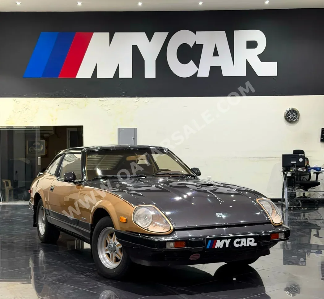 Nissan 280 ZX 1983 Manual 70,000 Km 6 Cylinder Rear Wheel Drive (RWD) Coupe / Sport gray and gold — image 1