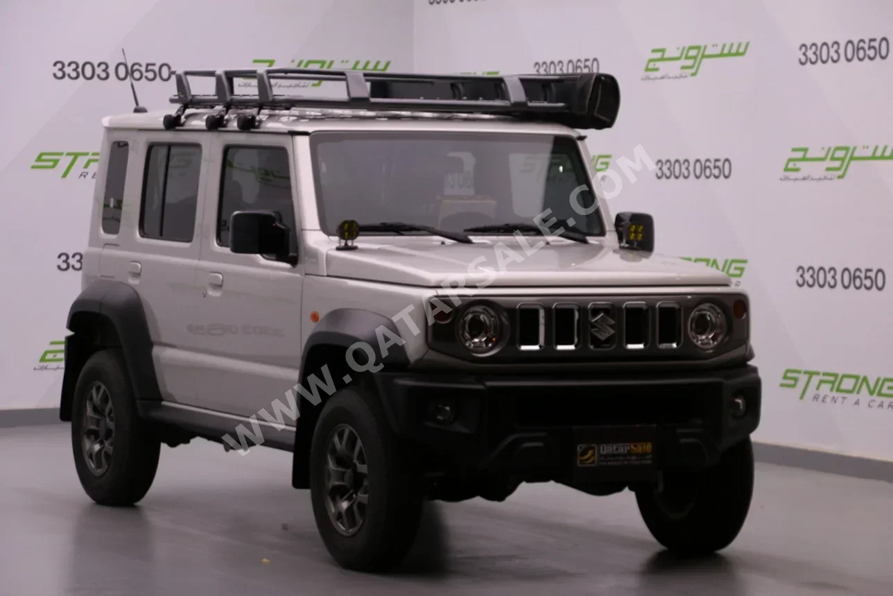 Suzuki  Jimny  2024  Automatic  15,000 Km  4 Cylinder  Four Wheel Drive (4WD)  SUV  Gray  With Warranty