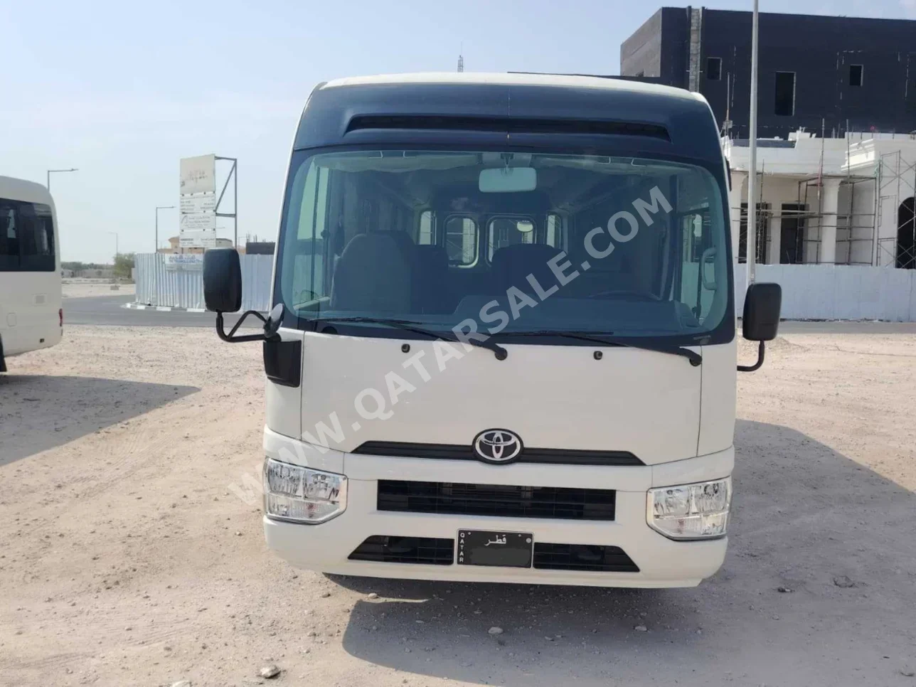 Toyota Coaster 2024 Automatic 225,000 Km 4 Cylinder Rear Wheel Drive (RWD) Van / Bus White