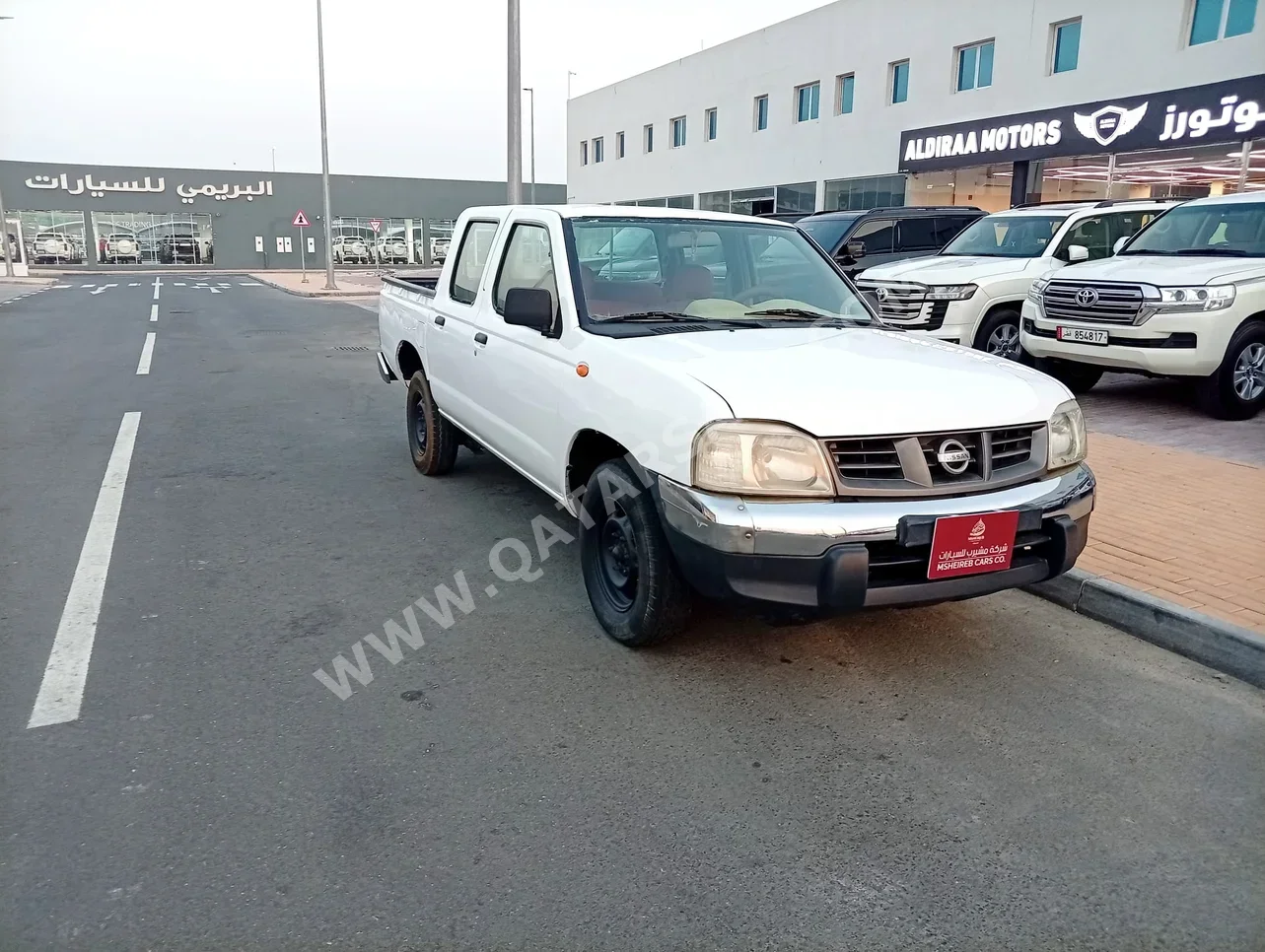 نيسان بيك أب 2006 عادي 318,000 كم 4 سلندر دفع خلفي بيكب أبيض