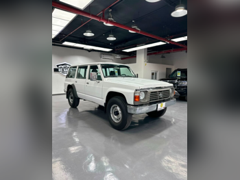 نيسان باترول جي ال 1997 عادي 112,000 كم 6 سلندر دفع رباعي اس يو في أبيض