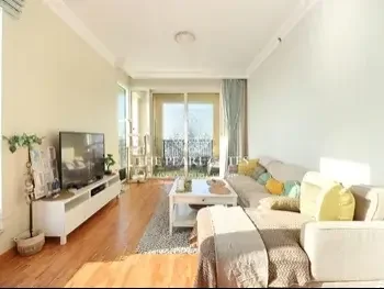 2 Bedrooms  Apartment  For Sale  in Doha -  The Pearl  Semi Furnished