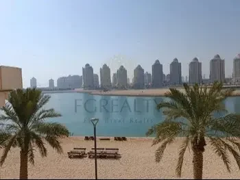 2 Bedrooms  Apartment  For Rent  in Doha -  The Pearl  Not Furnished