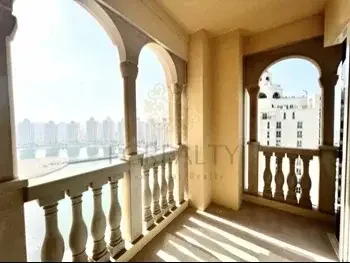 2 Bedrooms  Apartment  For Rent  in Doha -  The Pearl  Not Furnished