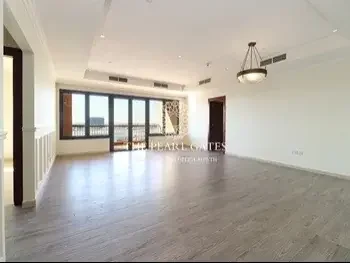 2 Bedrooms  Apartment  For Rent  in Doha -  The Pearl  Semi Furnished