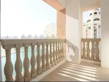 2 Bedrooms  Apartment  For Rent  in Doha -  The Pearl  Not Furnished