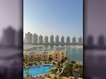 2 Bedrooms  Apartment  For Rent  in Doha -  The Pearl  Fully Furnished