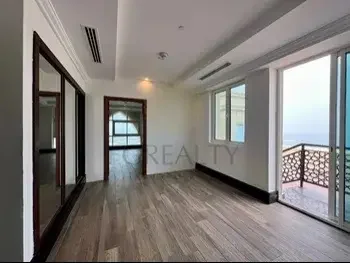 2 Bedrooms  Apartment  For Rent  in Doha -  The Pearl  Not Furnished