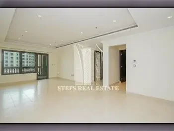 2 Bedrooms  Apartment  For Rent  in Doha -  The Pearl  Semi Furnished