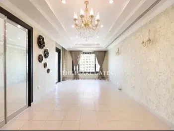 2 Bedrooms  Apartment  For Rent  in Doha -  The Pearl  Semi Furnished