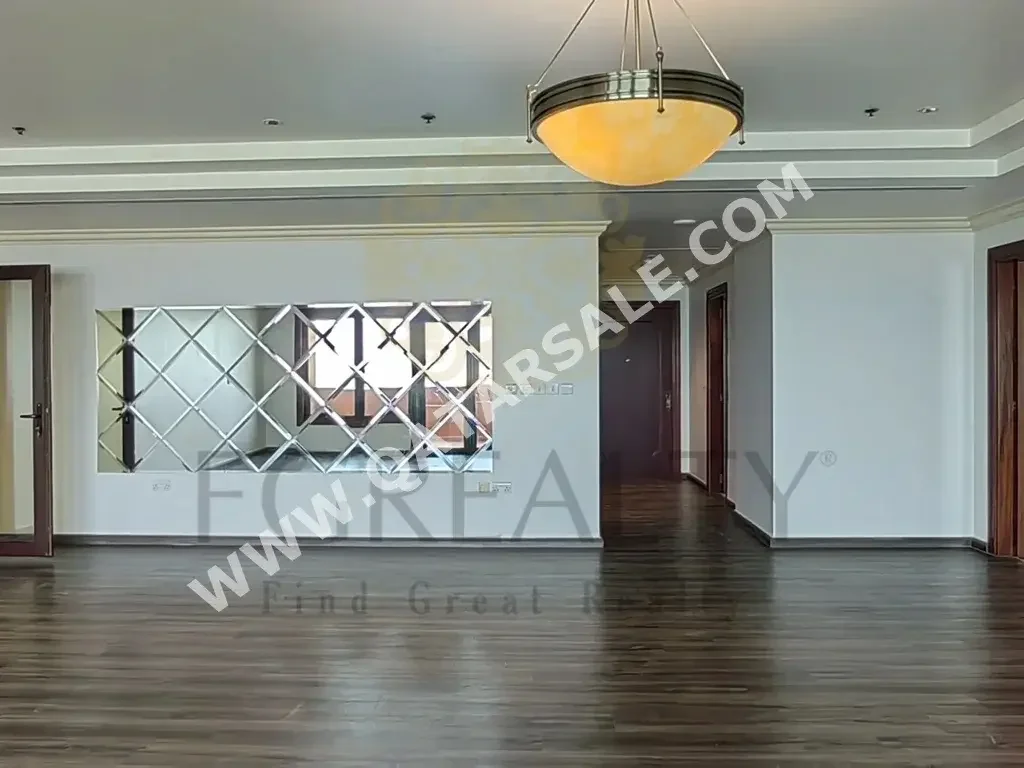 3 Bedrooms  Apartment  For Rent  in Doha -  The Pearl  Not Furnished